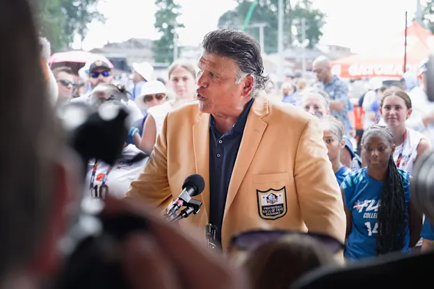 image: News OHSAA teams up with Hall of Fame, NFL for high school girls flag football announcementPro Football Hall of Famers RONDÉ BARBER, JOE DeLAMIELLEURE and ANTHONY MUÑOZ were on hand to celebrate the announcement.